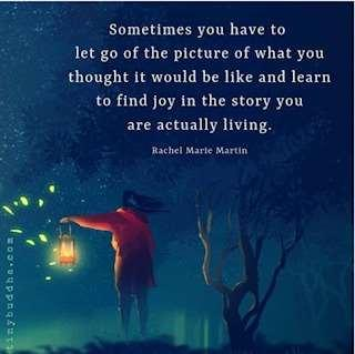 A person in a red coat holds a lantern amidst a dark, wooded landscape. The text reflects on finding joy in real-life experiences, attributed to Rachel Marie Martin.